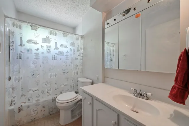 a balcony with wooden floor and fence