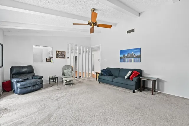 a view of a livingroom with furniture and a couch