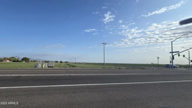 a view of a green field with clear sky