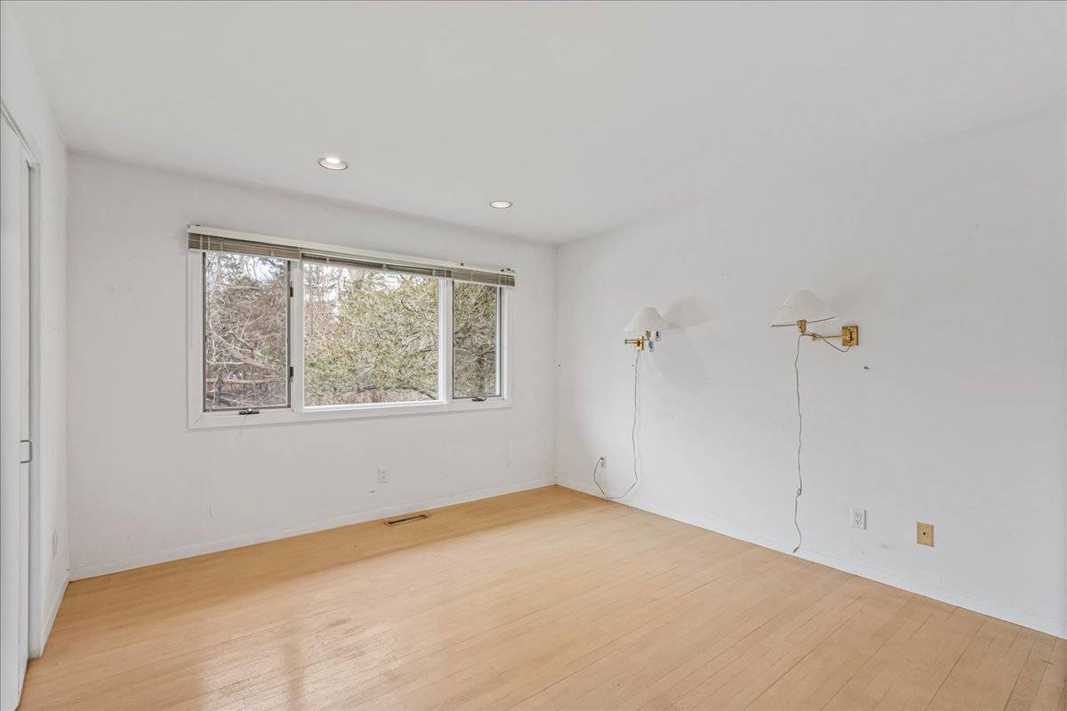 8 Fiddler Crab Trail Westhampton, NY 11977 - Photo 22 of 43 a view of an empty room with a window