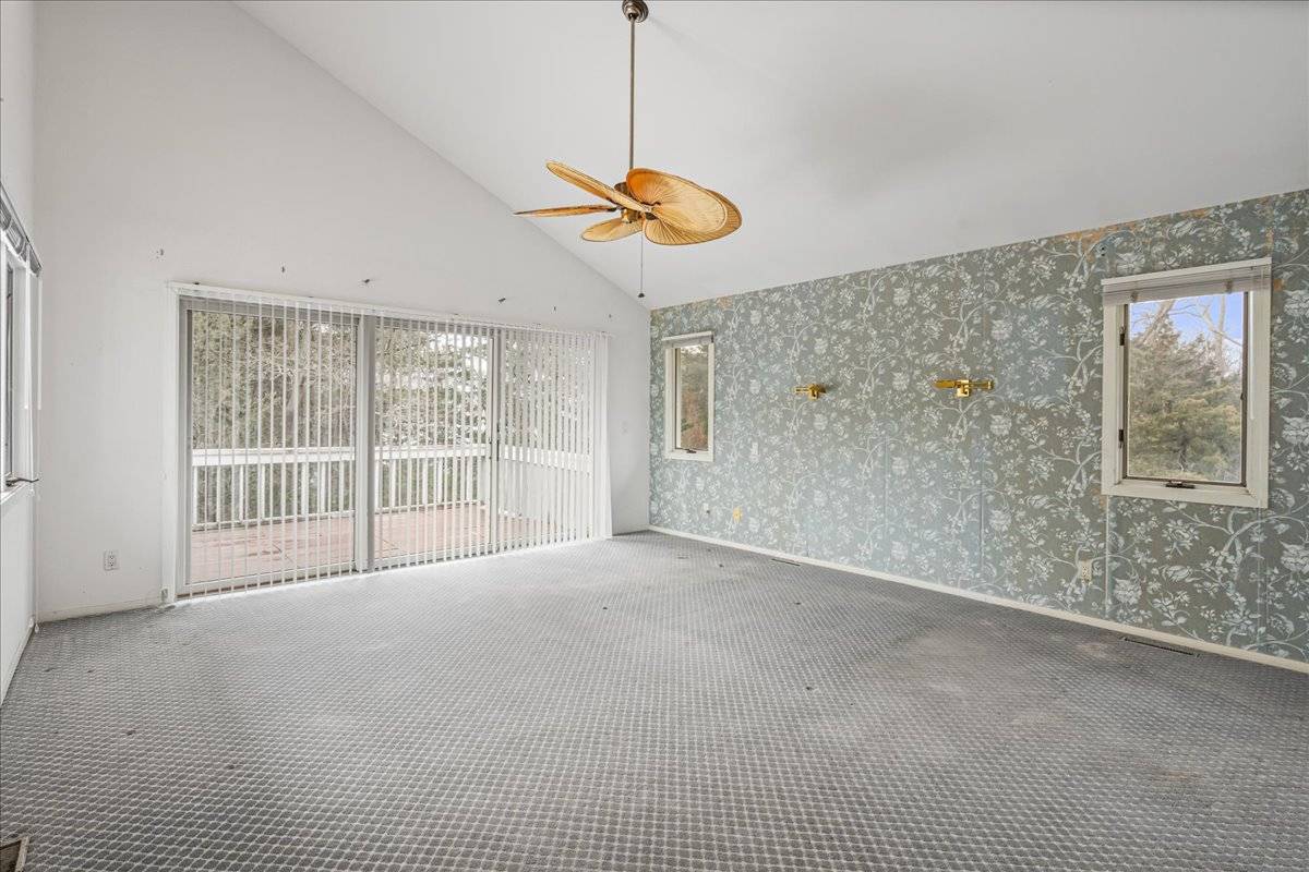 8 Fiddler Crab Trail Westhampton, NY 11977 - Photo 29 of 43 a view of an empty room with a window