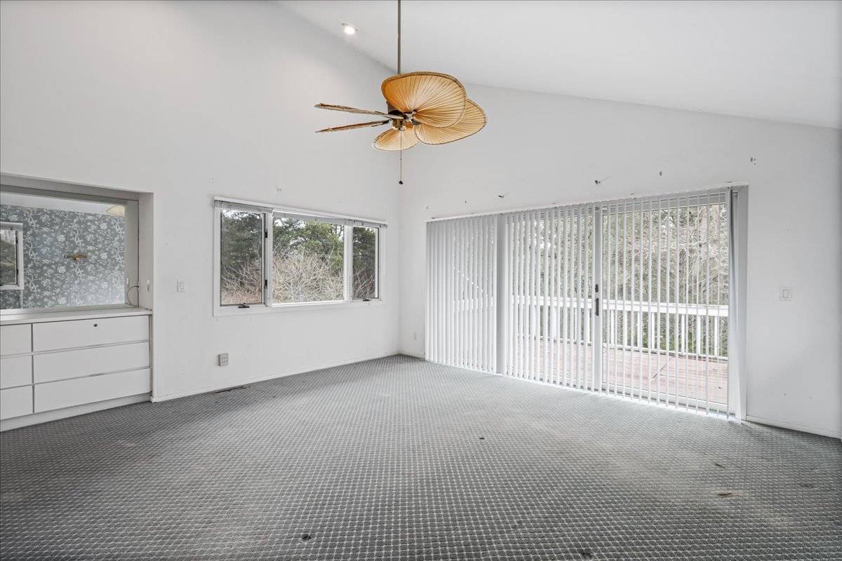8 Fiddler Crab Trail Westhampton, NY 11977 - Photo 31 of 43 a view of an empty room with a window