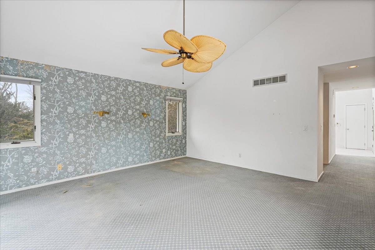 8 Fiddler Crab Trail Westhampton, NY 11977 - Photo 32 of 43 a view of a livingroom with a chandelier
