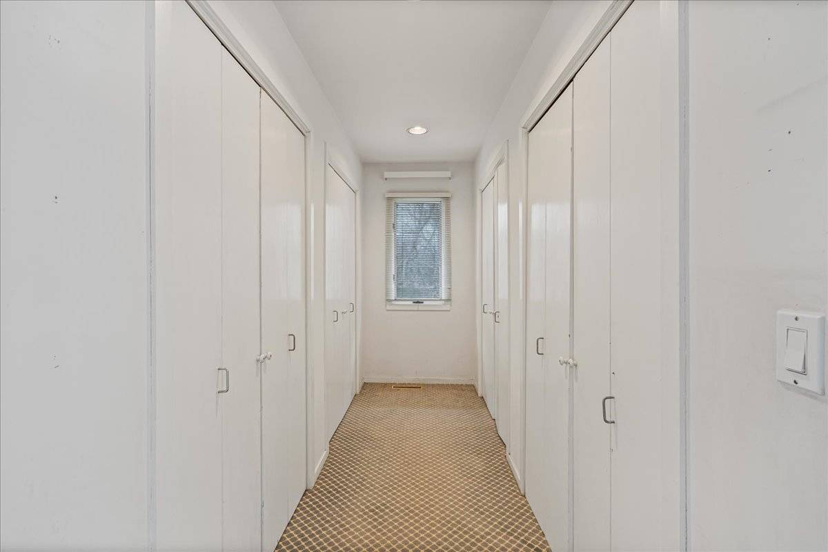 8 Fiddler Crab Trail Westhampton, NY 11977 - Photo 35 of 43 a view of a hallway with wooden shelves
