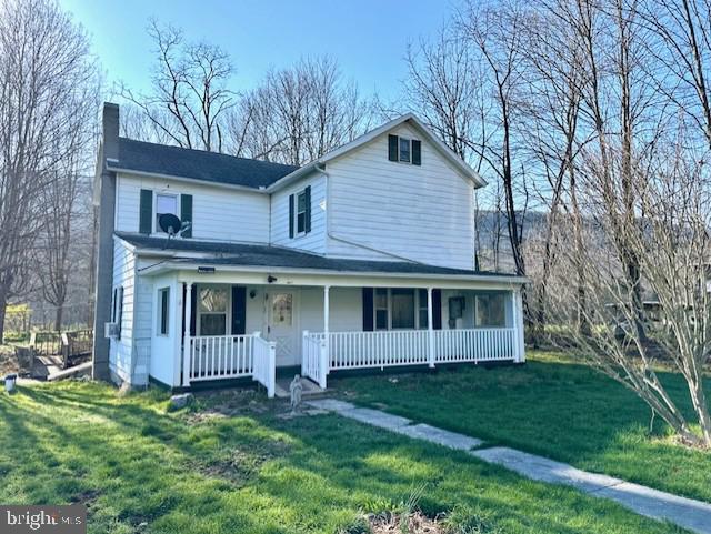 7016 Hyndman Road Buffalo Mills, PA 15534 - Photo 32 of 47 a view of an house with backyard space and garden