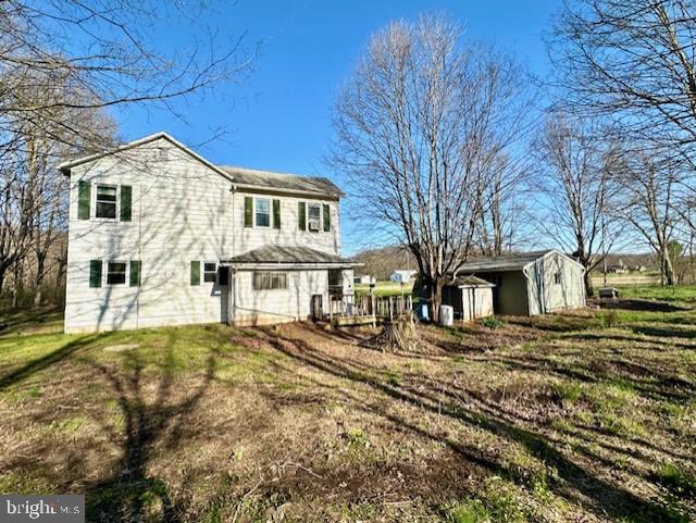 7016 Hyndman Road Buffalo Mills, PA 15534 - Photo 7 of 47 a view of a white house with a large tree