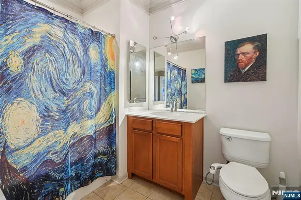 a bathroom with a toilet a sink and a mirror
