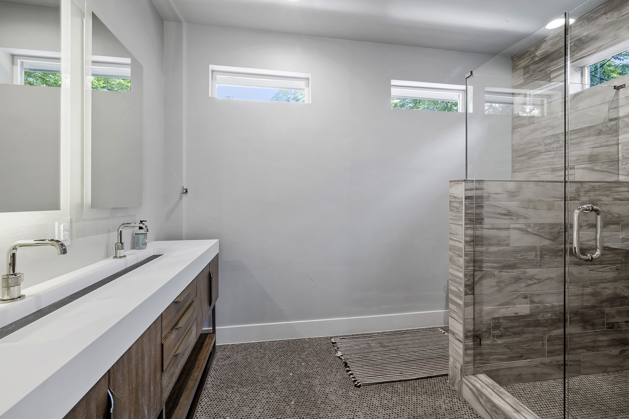 2414 Kinney Road Austin, TX 78704 - Photo 14 of 40 a bathroom with a double vanity sink and mirror