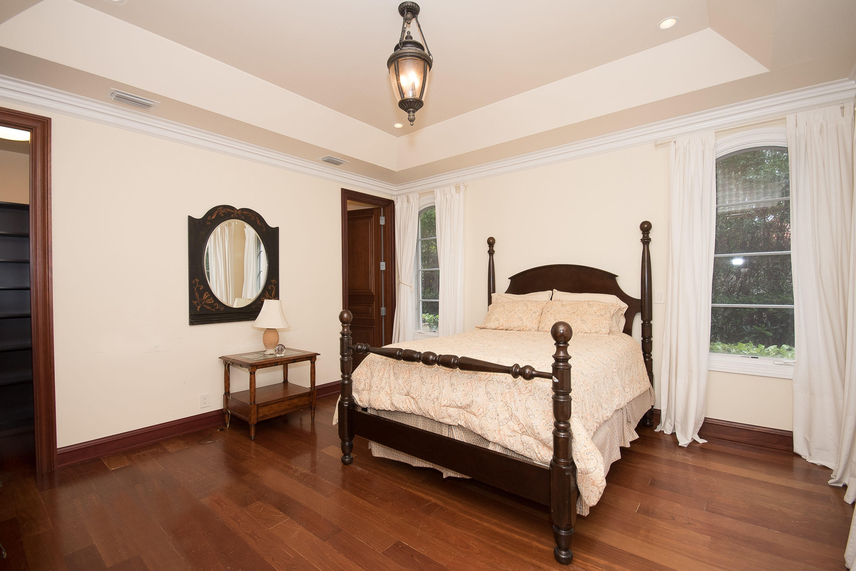 150 Woodbridge Road Palm Beach, FL 33480 - Photo 12 of 32 a bedroom with bed and a window