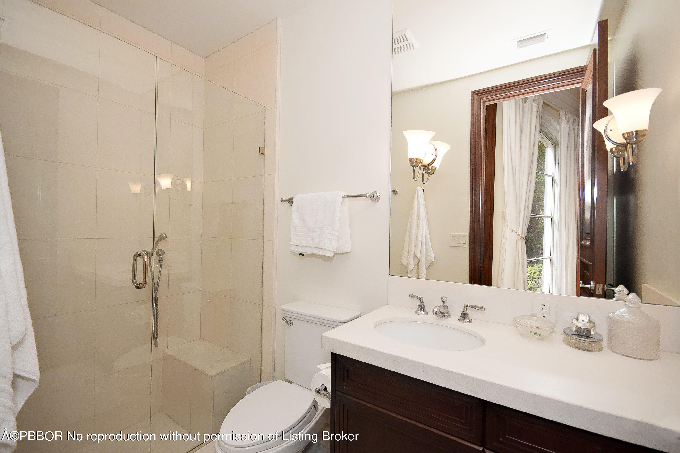 150 Woodbridge Road Palm Beach, FL 33480 - Photo 13 of 32 a bathroom with a sink a toilet and shower