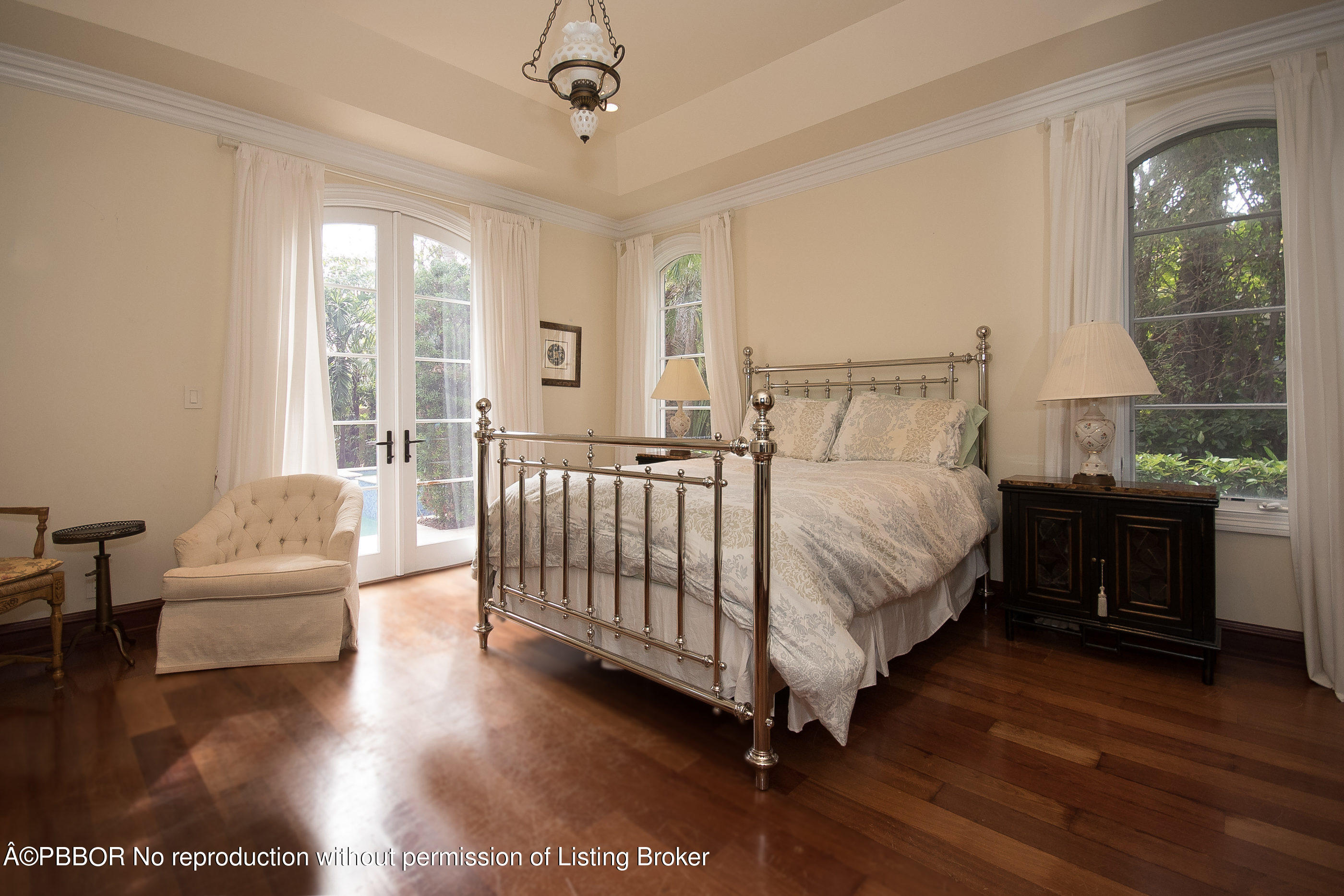 150 Woodbridge Road Palm Beach, FL 33480 - Photo 16 of 32 a bed room with a bed and a couch