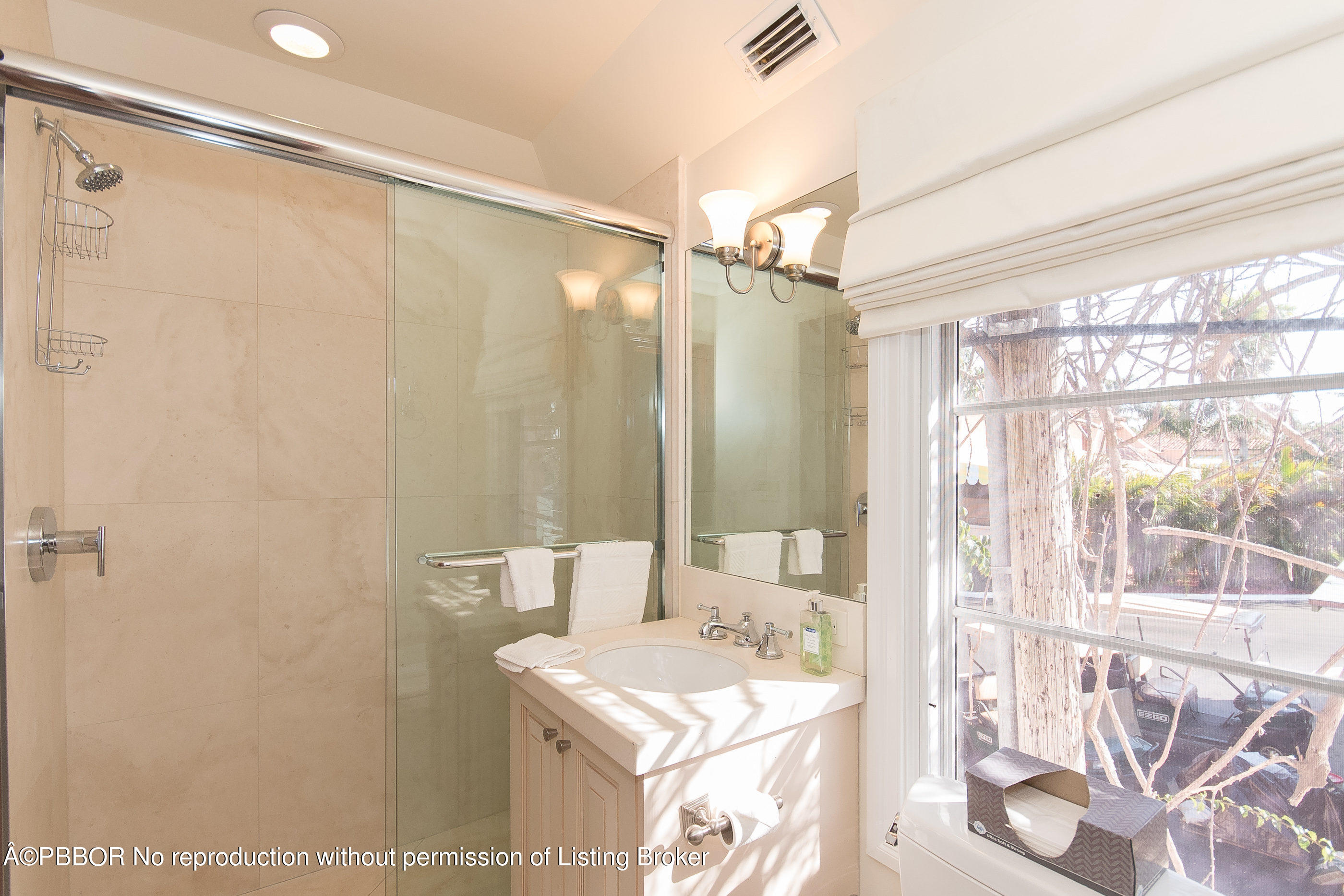150 Woodbridge Road Palm Beach, FL 33480 - Photo 26 of 32 a bathroom with a sink mirror and a shower