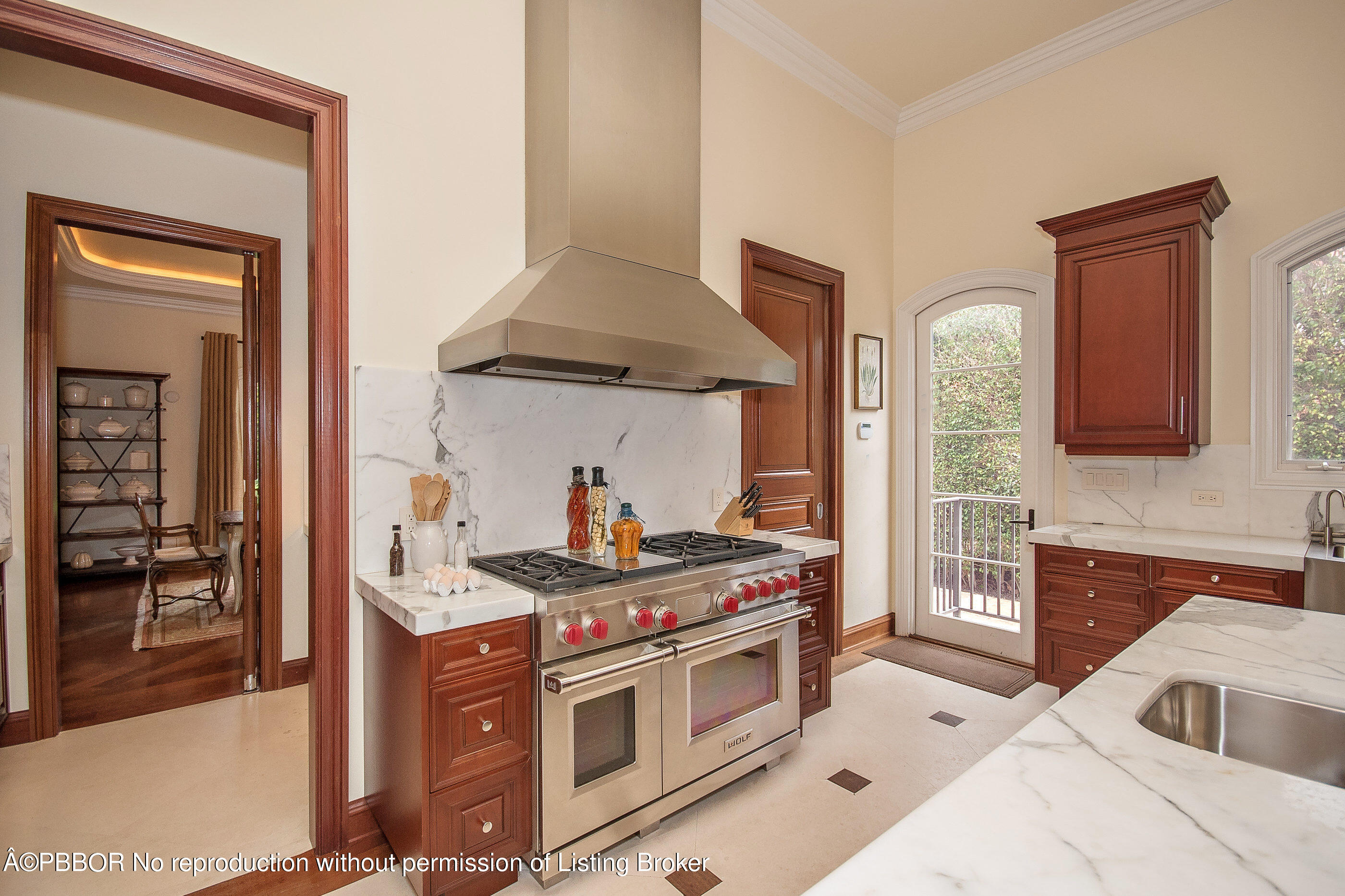 150 Woodbridge Road Palm Beach, FL 33480 - Photo 8 of 32 a kitchen with stainless steel appliances granite countertop a stove and a sink