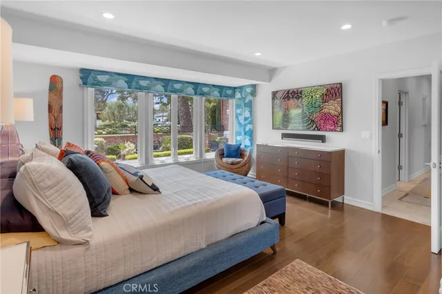 a bedroom with a bed and a couch