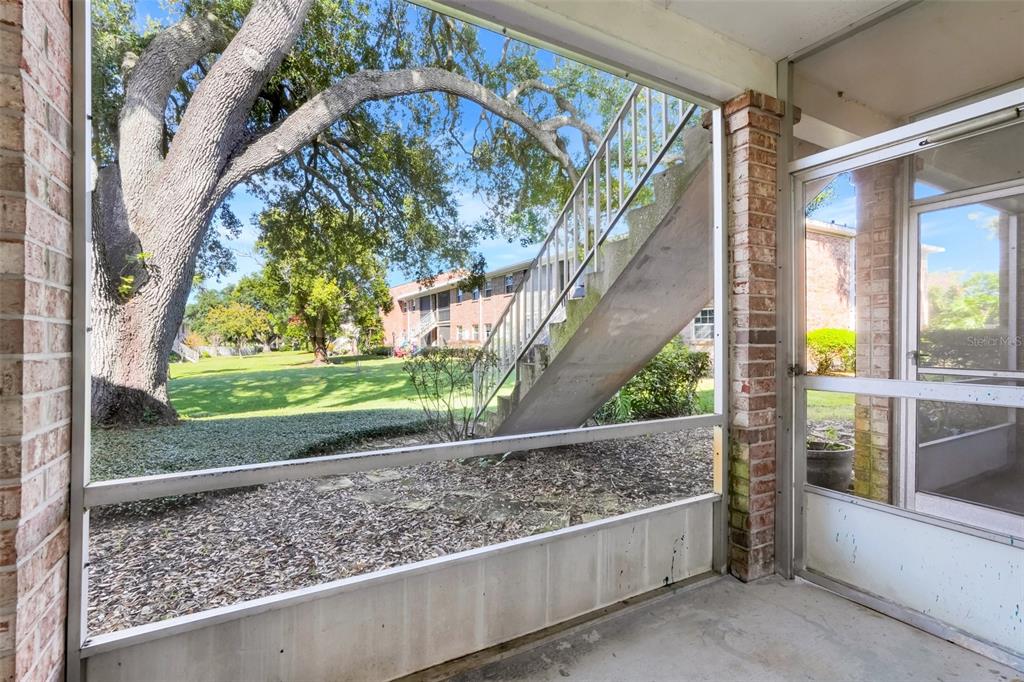4312 Lake Underhill Road, Unit 19 Orlando, FL 32803 - Photo 20 of 43 a view of a porch