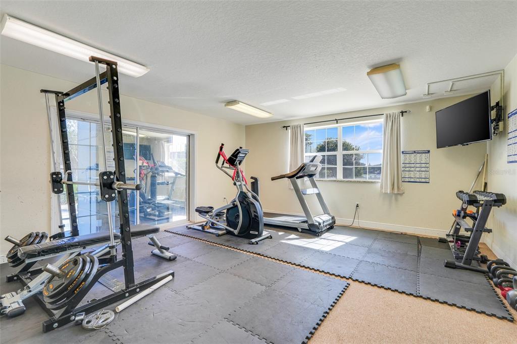 4312 Lake Underhill Road, Unit 19 Orlando, FL 32803 - Photo 36 of 43 a view of a room with gym equipment