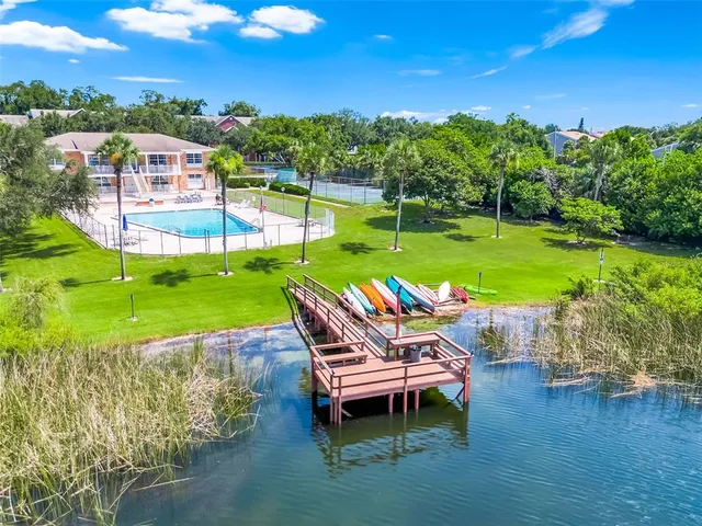 a view of sitting space next to a lake