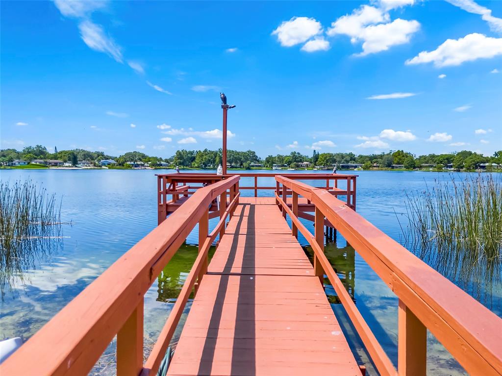 4312 Lake Underhill Road, Unit 19 Orlando, FL 32803 - Photo 41 of 43 a view of sitting space next to a lake