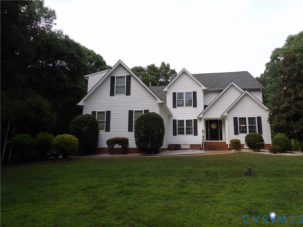 7106 Swiftrock Ridge Place Chesterfield, VA 23838 - Photo 1 of 4 Two-story residence featuring white siding and a m