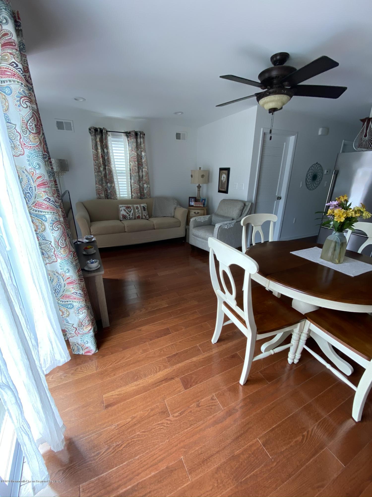 51 Gravelly Point Road Highlands, NJ 07732 - Photo 7 of 39 a room with gym equipment and wooden floor