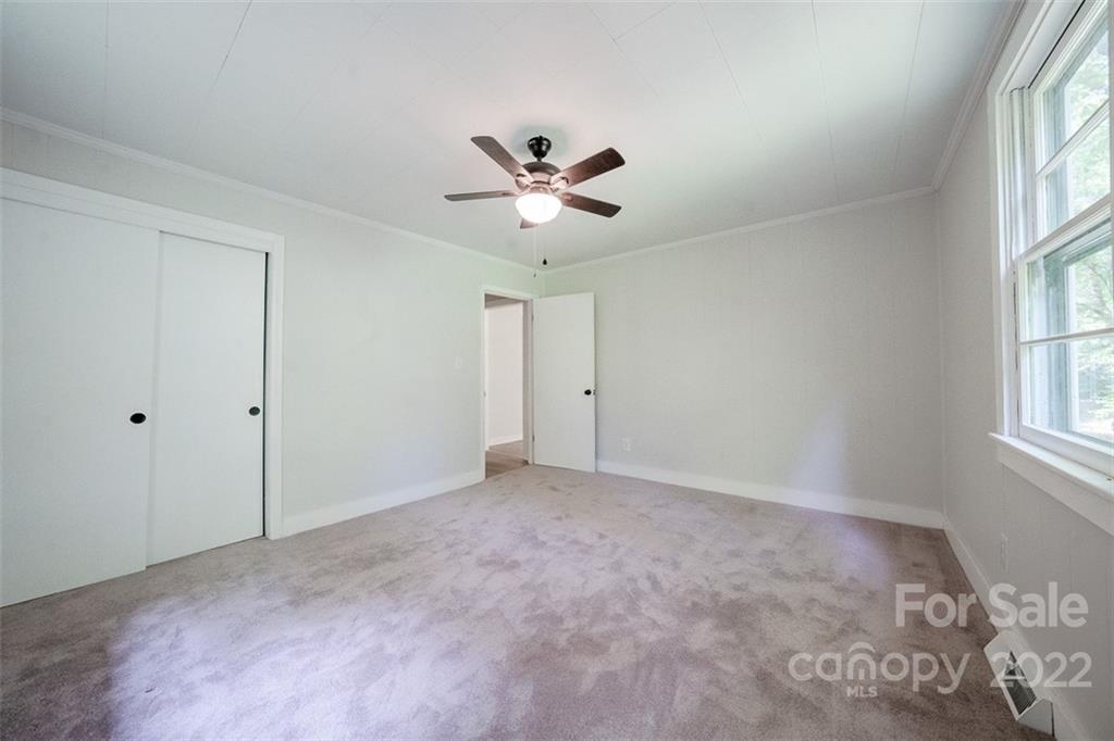 150 Archer Road Salisbury, NC 28147 - Photo 11 of 20 an empty room with windows and fan