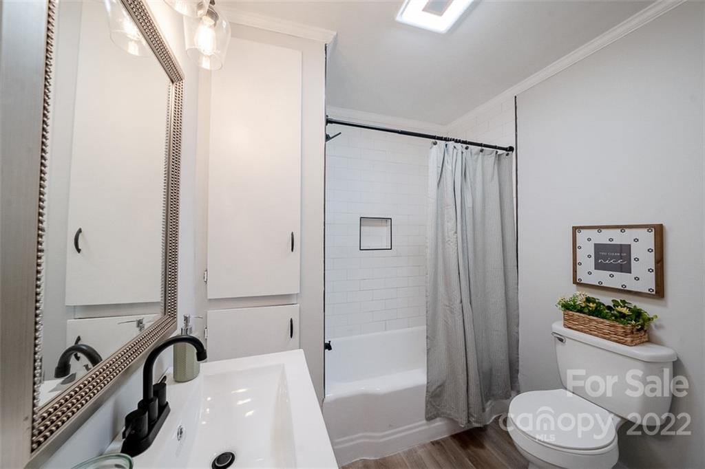 150 Archer Road Salisbury, NC 28147 - Photo 13 of 20 a bathroom with a sink a toilet and shower