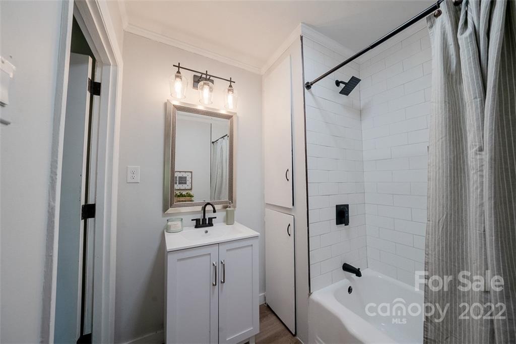 150 Archer Road Salisbury, NC 28147 - Photo 14 of 20 a bathroom with a tub a sink and a mirror