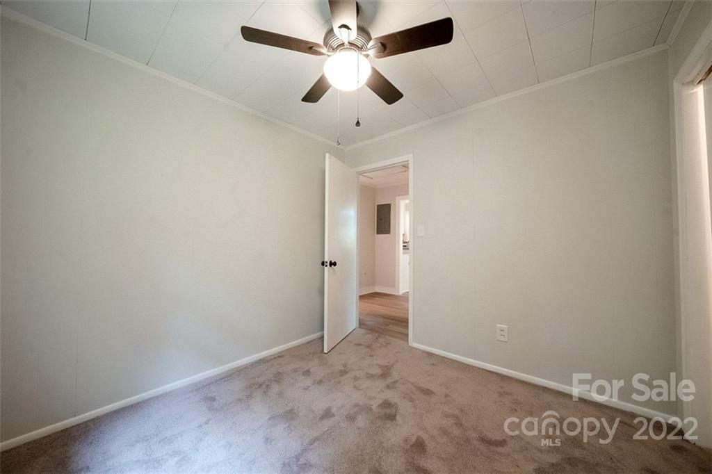 150 Archer Road Salisbury, NC 28147 - Photo 16 of 20 an empty room with closet and a chandelier fan