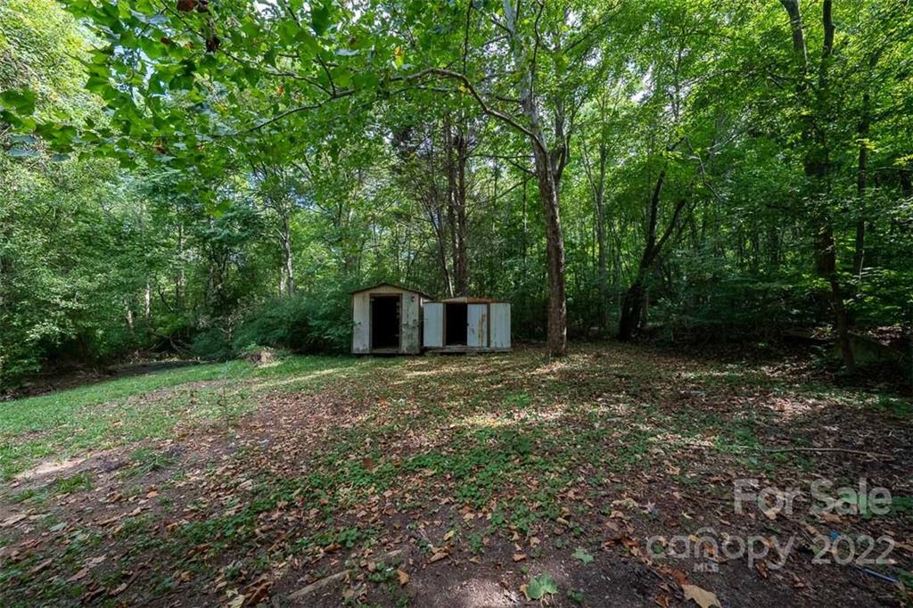 150 Archer Road Salisbury, NC 28147 - Photo 20 of 20 a big yard with lots of green space and trees