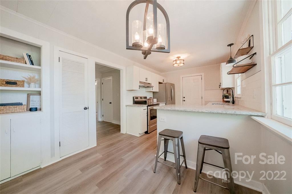 150 Archer Road Salisbury, NC 28147 - Photo 5 of 20 a view of a kitchen with dining table and chairs