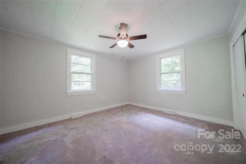 150 Archer Road Salisbury, NC 28147 - Photo 10 of 20 a view of a room with windows and chandelier fan