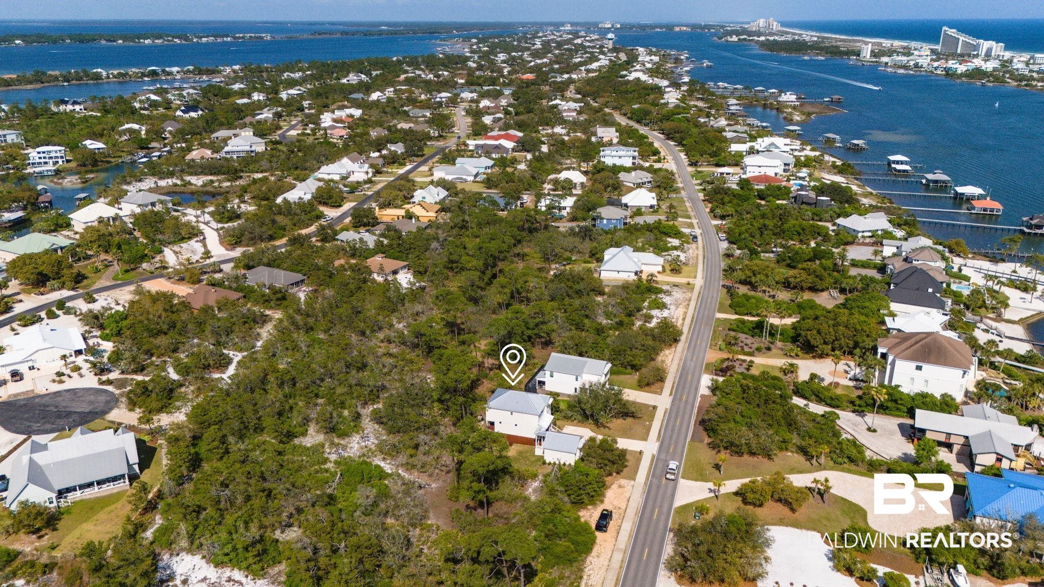 30449 River Road Orange Beach, AL 36561 - Photo 32 of 39 Aerial perspective of suburban area with a large body of water