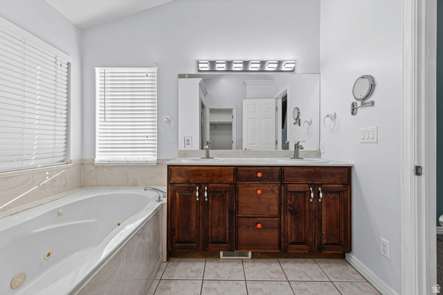 4117 North Wolf Ridge Circle Eden, UT 84310 - Photo 24 of 63 Dual vanity with integrated sinks and a large mirror, set against a light-toned countertop