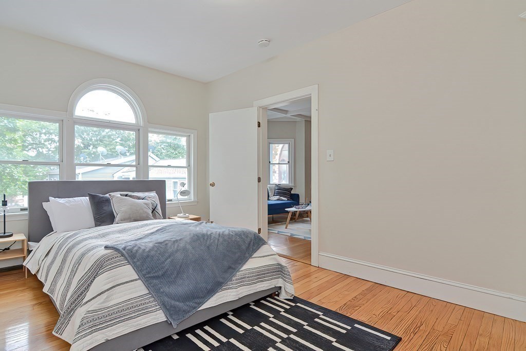 87 Broad Street, Unit 2 Lynn, MA 01902 - Photo 11 of 28 a bedroom with a bed and window