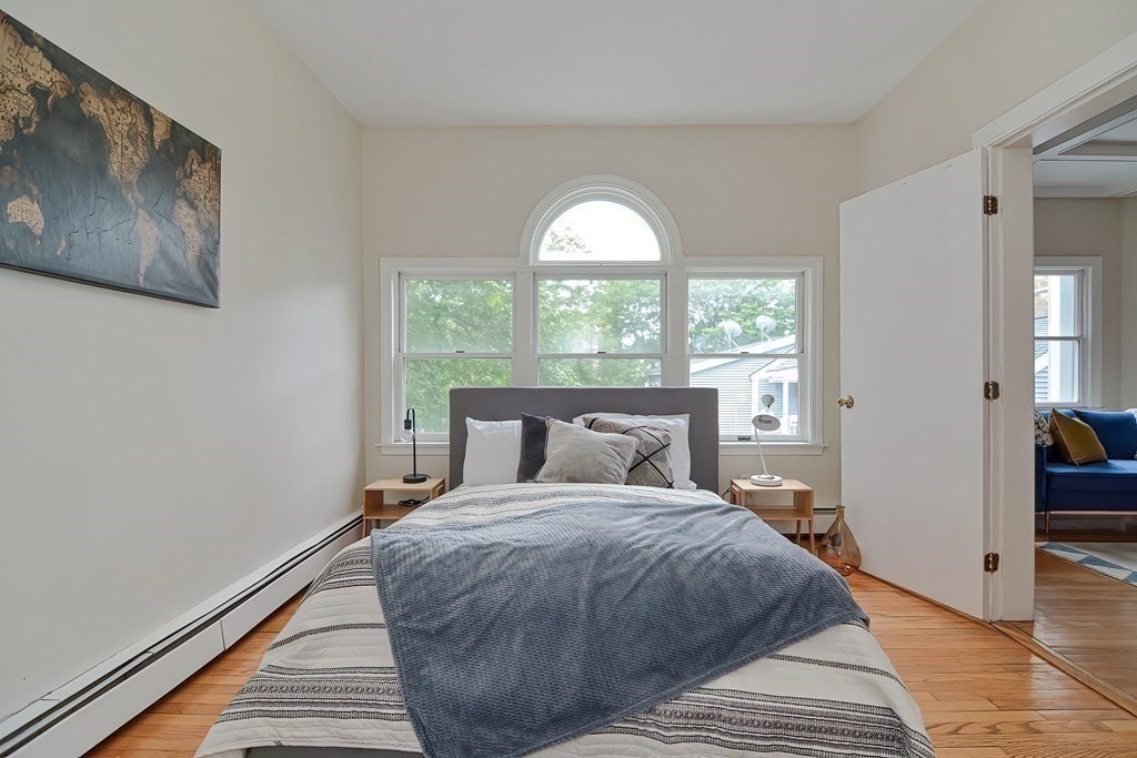 87 Broad Street, Unit 2 Lynn, MA 01902 - Photo 13 of 28 a bedroom with a bed and a large window
