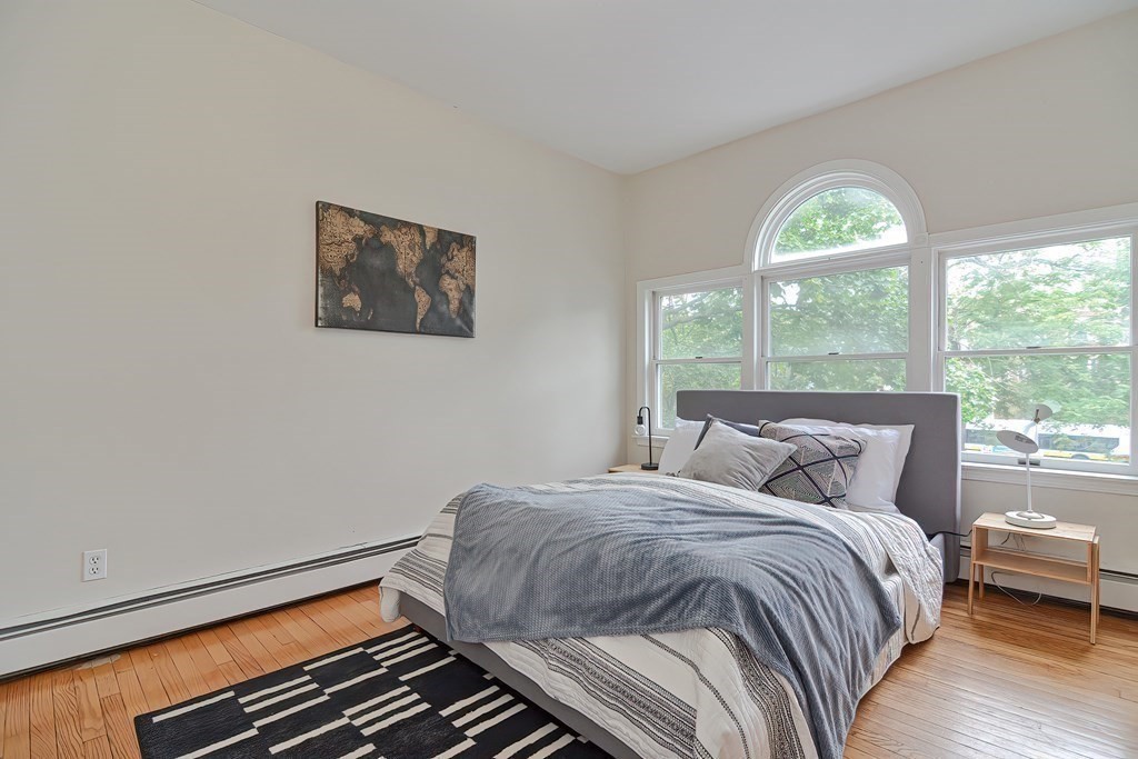 87 Broad Street, Unit 2 Lynn, MA 01902 - Photo 15 of 28 a bedroom with a bed and a window