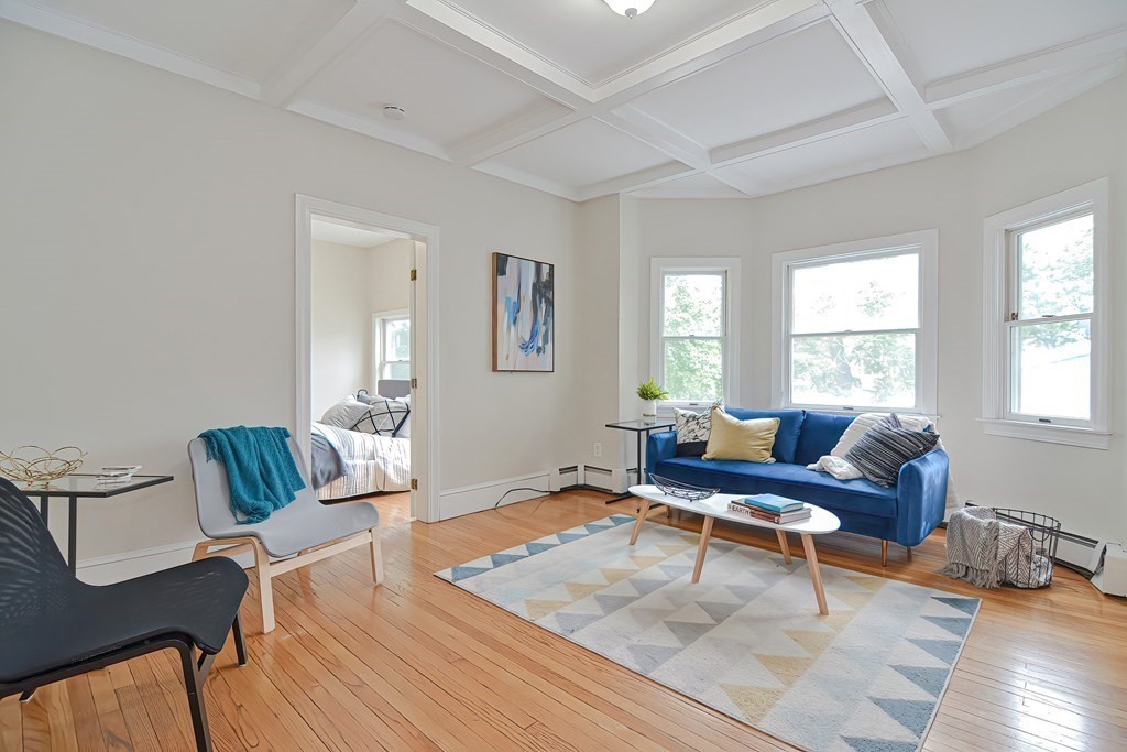 87 Broad Street, Unit 2 Lynn, MA 01902 - Photo 2 of 28 a living room with furniture and wooden floor