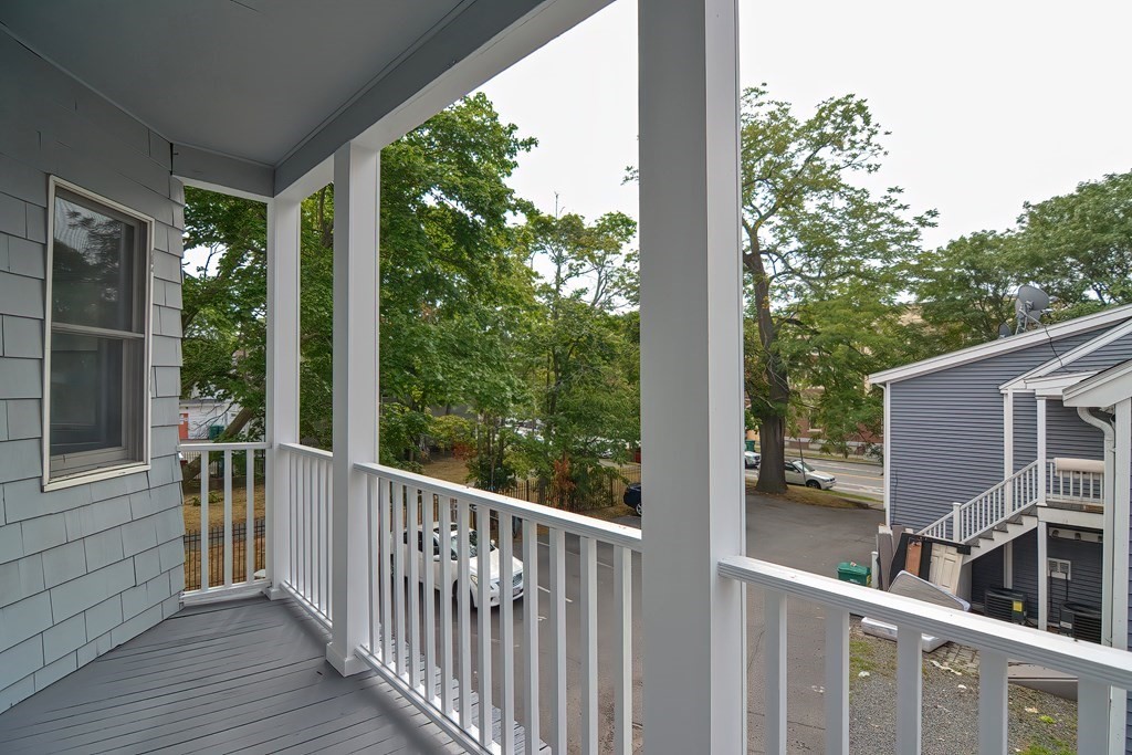 87 Broad Street, Unit 2 Lynn, MA 01902 - Photo 26 of 28 a view of a balcony with wooden floor