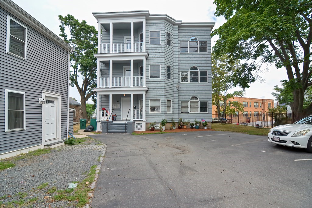 87 Broad Street, Unit 2 Lynn, MA 01902 - Photo 28 of 28 a view of a parked cars in front of a building