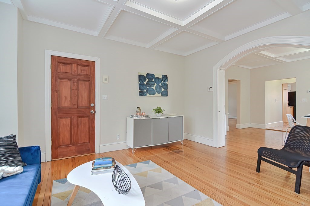 87 Broad Street, Unit 2 Lynn, MA 01902 - Photo 4 of 28 a living room with furniture and a wooden floor