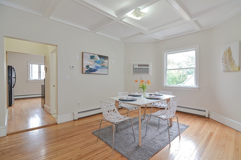 87 Broad Street, Unit 2 Lynn, MA 01902 - Photo 7 of 28 a view of a dining room with furniture and wooden floor