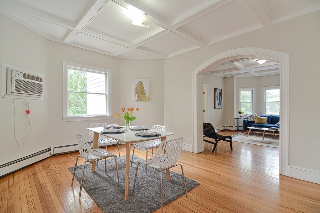 87 Broad Street, Unit 2 Lynn, MA 01902 - Photo 8 of 28 a view of a dining room with furniture and wooden floor