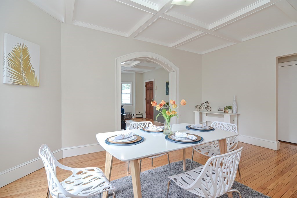 87 Broad Street, Unit 2 Lynn, MA 01902 - Photo 9 of 28 a view of a dining room with furniture and wooden floor