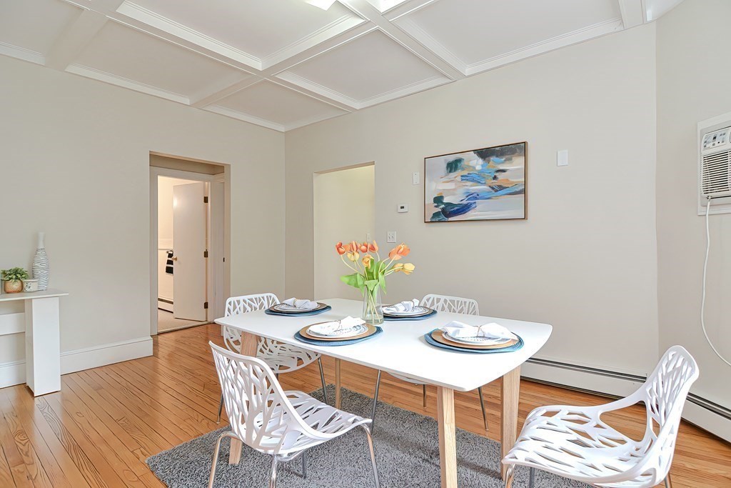 87 Broad Street, Unit 2 Lynn, MA 01902 - Photo 10 of 28 a dining room with furniture and wooden floor