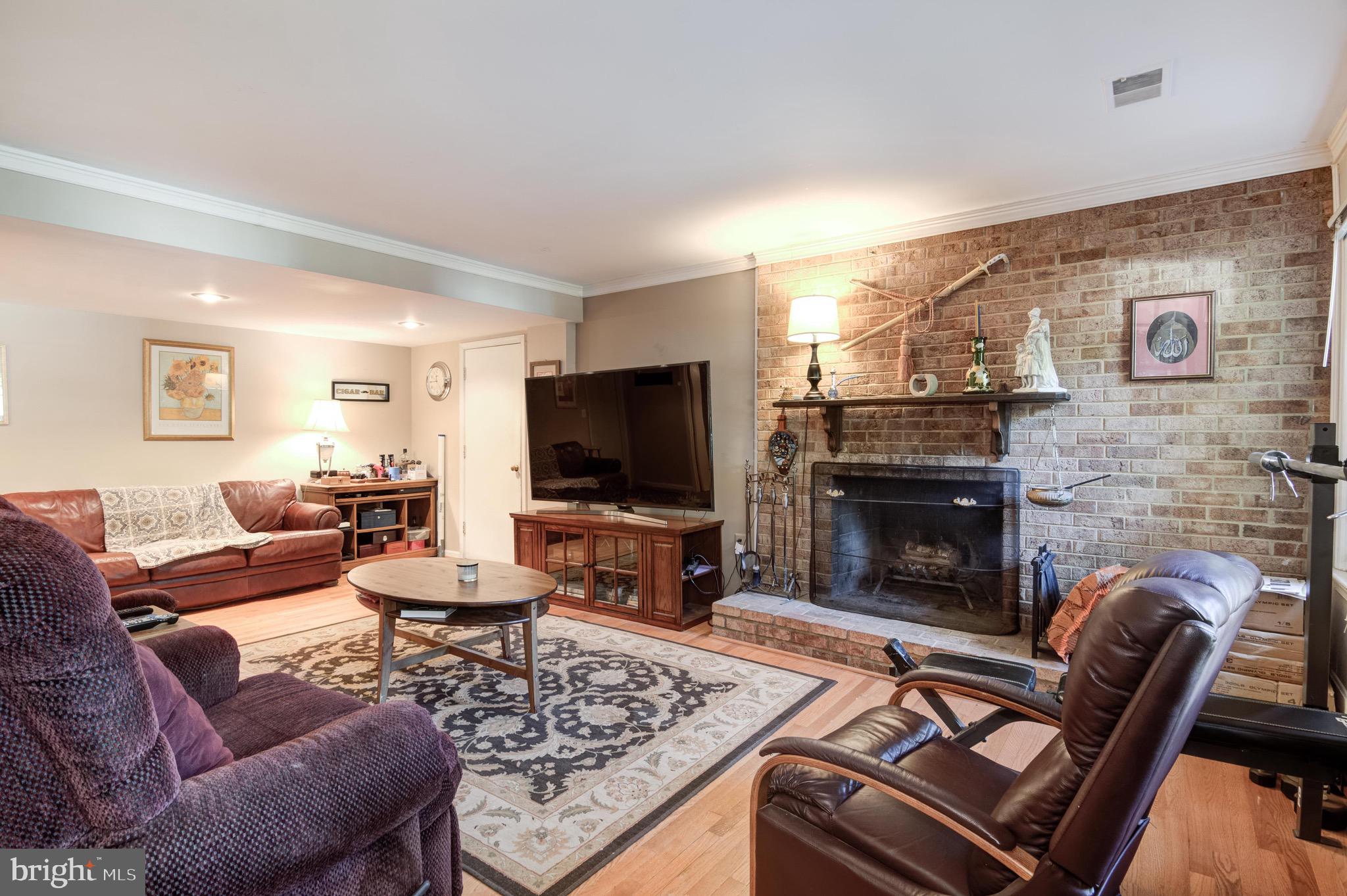 7915 Laural Valley Way Springfield, VA 22153 - Photo 16 of 19 Downstairs family room w/wood burning fireplace