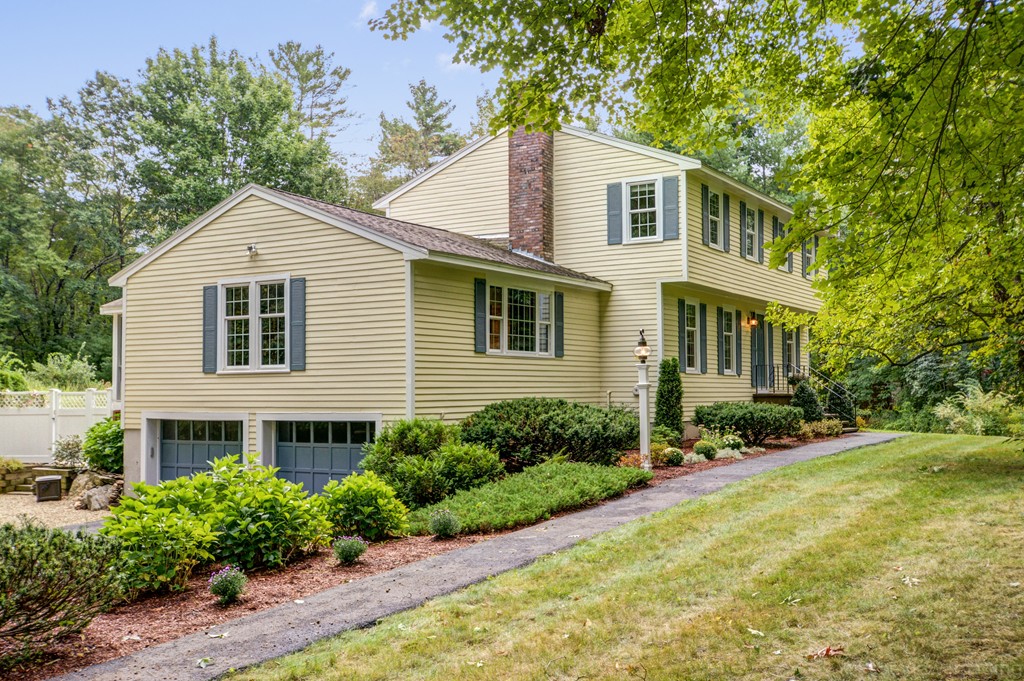 351 Liberty Square Road Boxborough, MA 01719 - Photo 1 of 30 a front view of a house with a yard and trees