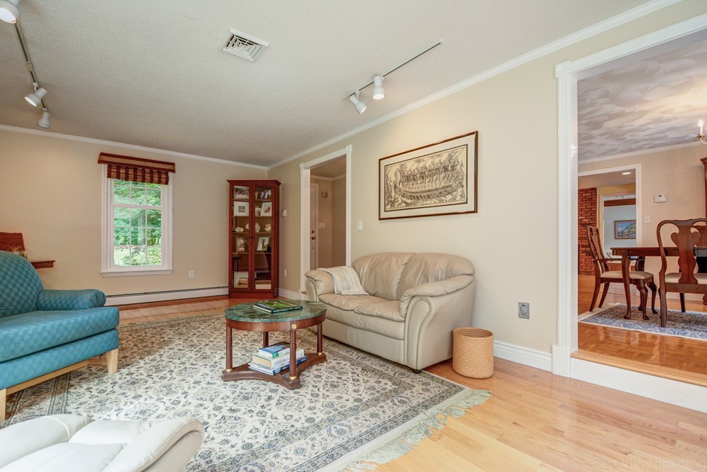351 Liberty Square Road Boxborough, MA 01719 - Photo 11 of 30 a living room with furniture and wooden floor