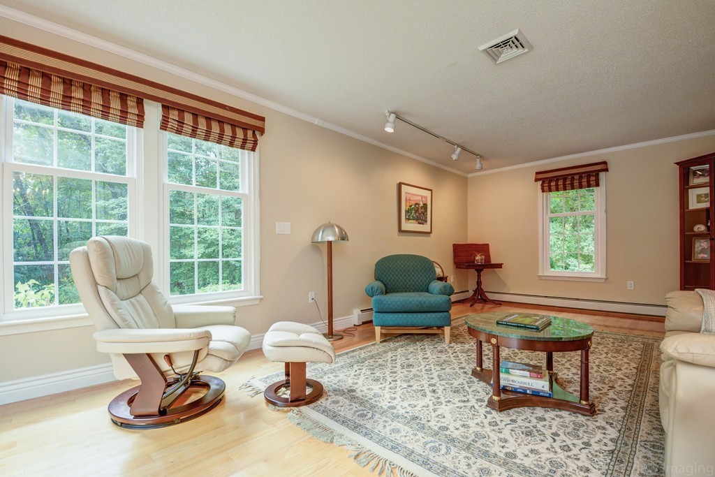 351 Liberty Square Road Boxborough, MA 01719 - Photo 12 of 30 a living room with furniture a rug and a window