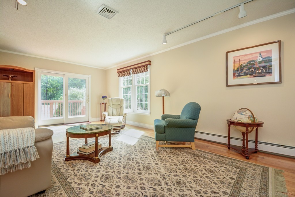 351 Liberty Square Road Boxborough, MA 01719 - Photo 13 of 30 a living room with furniture and a large window