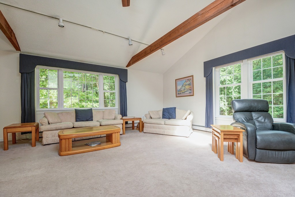 351 Liberty Square Road Boxborough, MA 01719 - Photo 15 of 30 a living room with furniture and large windows